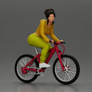 Sporty girl riding a red bike in bright yellow tracksuit - Only-Games