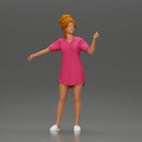 Woman in pink dress dancing joyfully with raised arms sideways - Only-Games