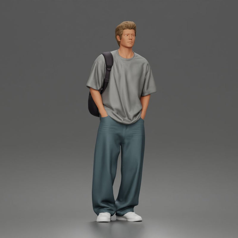 Student standing with backpack wearing oversized tee and baggy jeans
