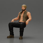 Muscular Bearded Man in Beanie Vest Pants Sitting Casually Relaxed - Only-Games