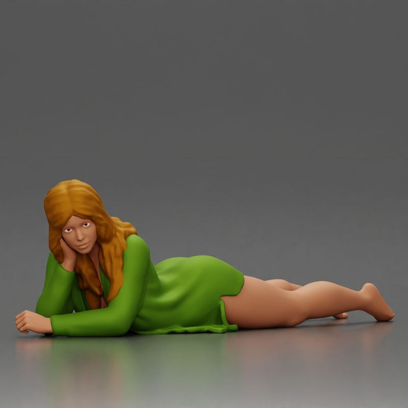 Girl with long hair in green dress lying with calm on the beach - Only-Games