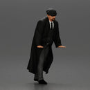 Man in black coat wearing flat cap standing with serious expression - Only-Games