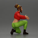 Fashionable woman kneeling in red jacket, green pants, and black boots - Only-Games