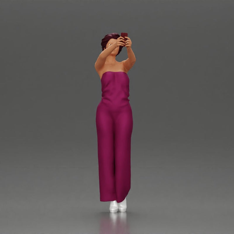 Fashionable woman in a jumpsuit snapping a selfie in style - Only-Games