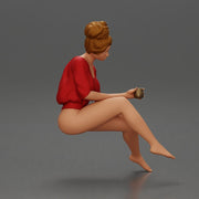 Relaxed girl in red sipping coffee enjoying a peaceful moment on the beach - Only-Games