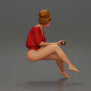 Relaxed girl in red sipping coffee enjoying a peaceful moment on the beach - Only-Games