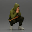 Gangster crouching low in green hoodie holding bat planning move - Only-Games