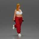 Strong woman power walking with dumbbells wearing white top and red pants - Only-Games
