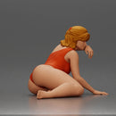 attractive woman in red swimsuit resting calmly on the beach - Only-Games