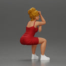 Stylish woman in red dress and sneakers striking dynamic pose - Only-Games