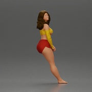 Woman in yellow top and red shorts leaning to wall - Only-Games