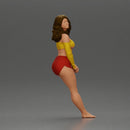 Woman in yellow top and red shorts leaning to wall - Only-Games