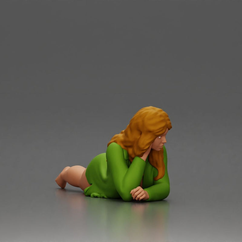 Girl with long hair in green dress lying with calm on the beach - Only-Games