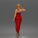 Elegant woman in sleeveless evening dress with side slit