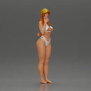 girl in a white bikini holding a phone on the beach and wearing a cap - Only-Games