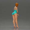 woman in a turquoise swimsuit striking a pose - Only-Games
