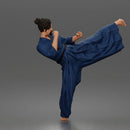 Man Performing Martial Arts High Kick Pose Gi Uniform Belt Barefoot Outfit