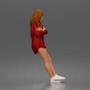 leaning woman folds arms open shirt swimwear bottoms and sneakers