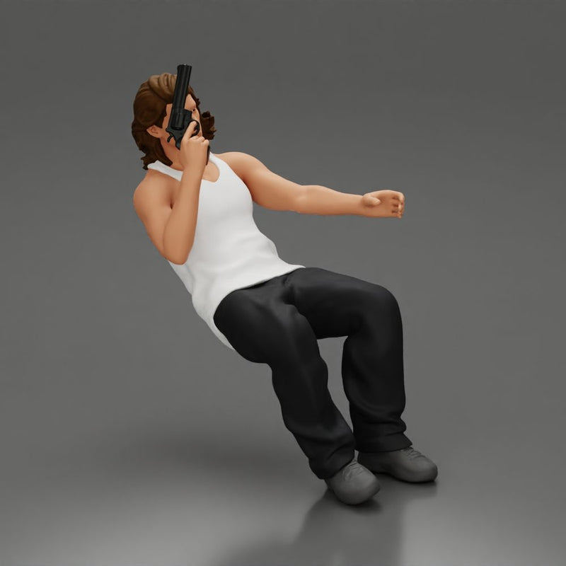 Man sitting with gun in hand pointing forward calmly - Only-Games