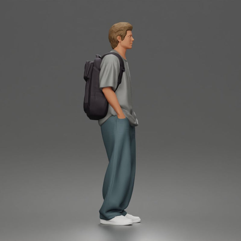 Student standing with backpack wearing oversized tee and baggy jeans