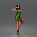 Elegant Woman Walking Confidently in Glamorous Dress, Heels, and Handbag