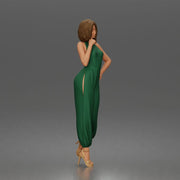 Woman poses thoughtfully lifting heel wearing halter jumpsuit with platform heels - Only-Games