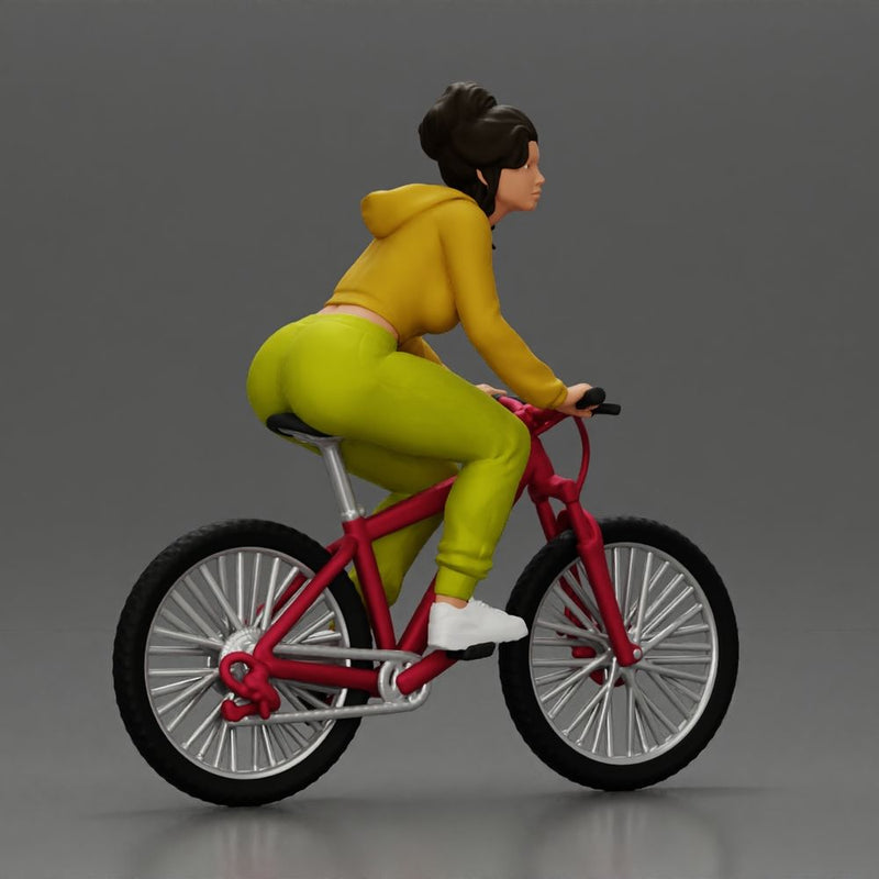 Sporty girl riding a red bike in bright yellow tracksuit - Only-Games