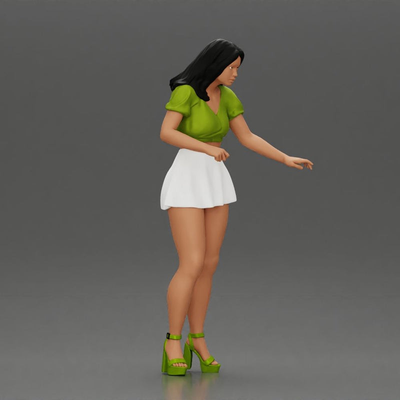 woman standing with a green top white skirt looking like they want to hold something - Only-Games