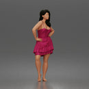 woman posing with hands on hips wearing ruffled dress