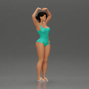Brunette woman in turquoise swimsuit stretching with elegant ballet pose - Only-Games