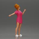 Woman in pink dress dancing joyfully with raised arms sideways - Only-Games