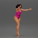Woman with short black hair wearing pink swimsuit raising arms - Only-Games