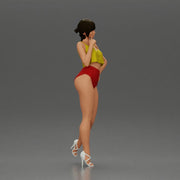 Striking a flirty pose wearing yellow crop top red bottoms - Only-Games