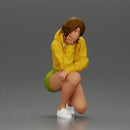 Performer crouching thoughtfully in yellow jacket green shorts white sneakers - Only-Games