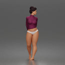 Standing woman looks back long sleeve top underwear bare feet