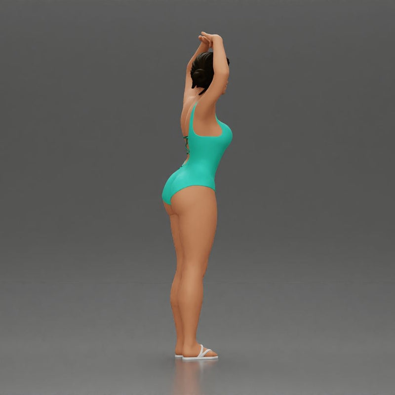 Brunette woman in turquoise swimsuit stretching with elegant ballet pose - Only-Games