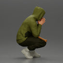 Gangster crouching low in green hoodie holding bat planning move - Only-Games