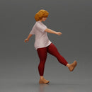 Woman in casual outfit joyfully kicks her leg with energy - Only-Games