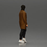 Man in brown coat glances sideways dressed in stylish winterwear - Only-Games