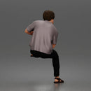 Man Sitting With Knee Bent In Shirt Trousers And Sandals