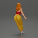 Woman sitting on car in red top yellow pants striking playful pose - Only-Games