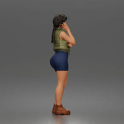 Thoughtful woman stands hand on cheek wearing vest shorts boots - Only-Games