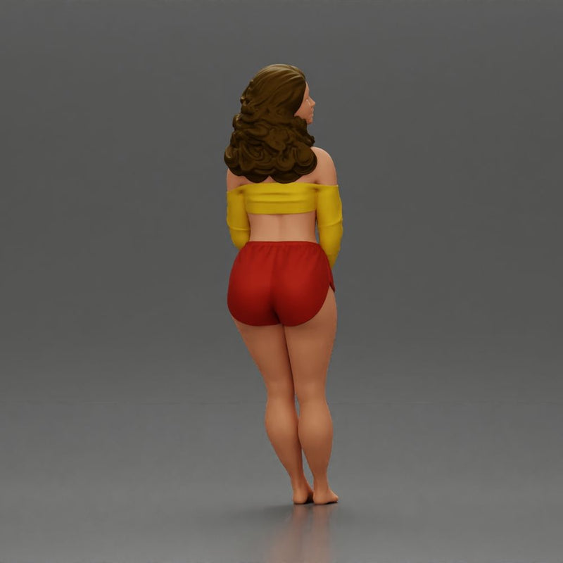 Woman in yellow top and red shorts leaning to wall - Only-Games