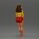 Woman in yellow top and red shorts leaning to wall - Only-Games