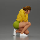 Performer crouching thoughtfully in yellow jacket green shorts white sneakers - Only-Games