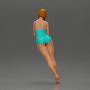 woman in a turquoise swimsuit striking a pose - Only-Games