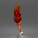 leaning woman folds arms open shirt swimwear bottoms and sneakers
