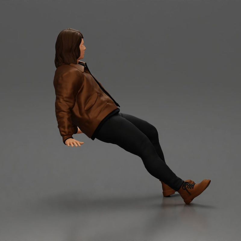 Man with long hair wearing brown jacket sitting with relaxed posture - Only-Games