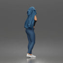 Woman Putting On Jacket Over Crop Tank And Leggings With Sneakers