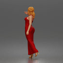Elegant woman in sleeveless evening dress with side slit